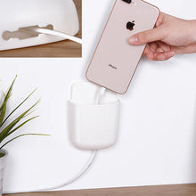 Wall-mounted storage for mobile with charging dock.