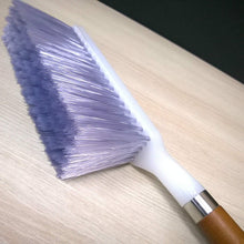 Efficient household cleaning brush with firm bristles