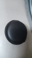 Round carrying case for earphones